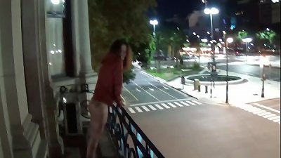 Outdoor public peeing from a balcony in America